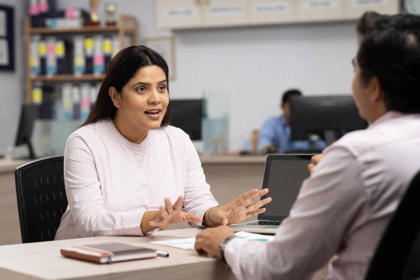 businesswoman talking to a colleague