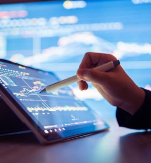 woman looking stock market data on smart phone