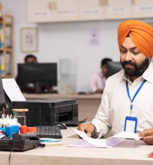indian sikh businessman working at office