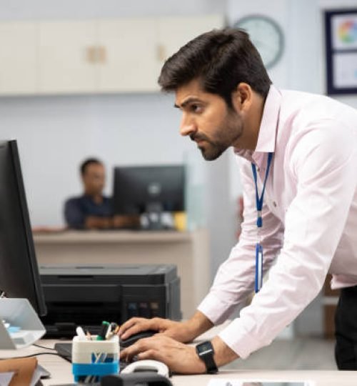 young business person using computer in bank