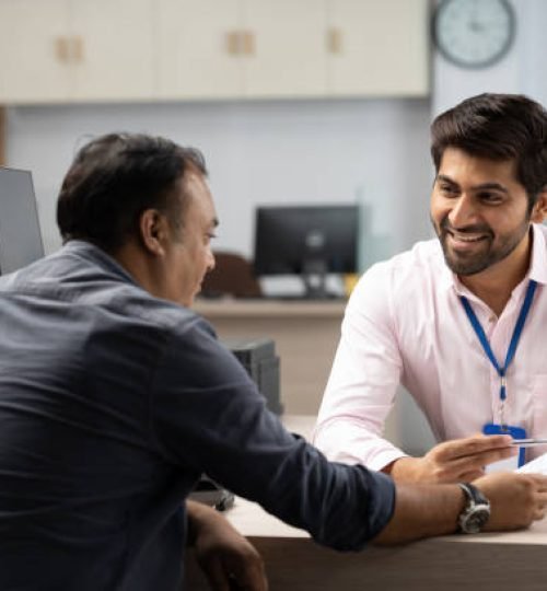 customer with bank manager in office